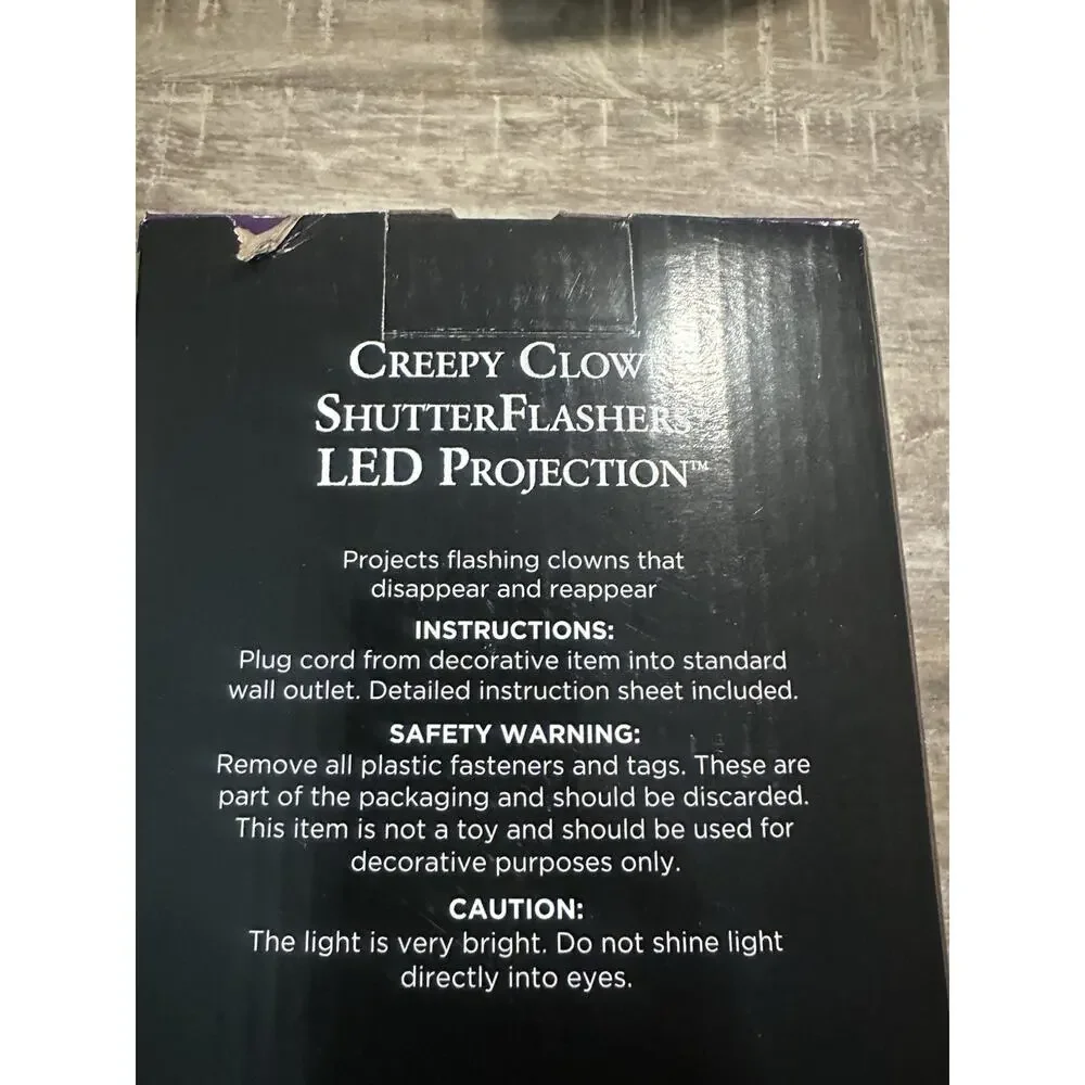 Shutter Flashers™ Creepy Clown Projection Spotlight - LightShow® Halloween LED